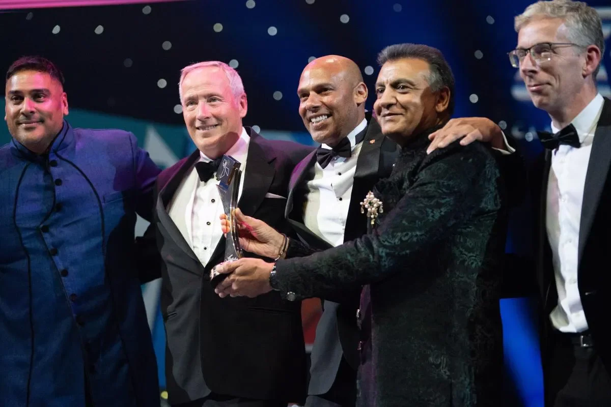 Winners receiving award on stage